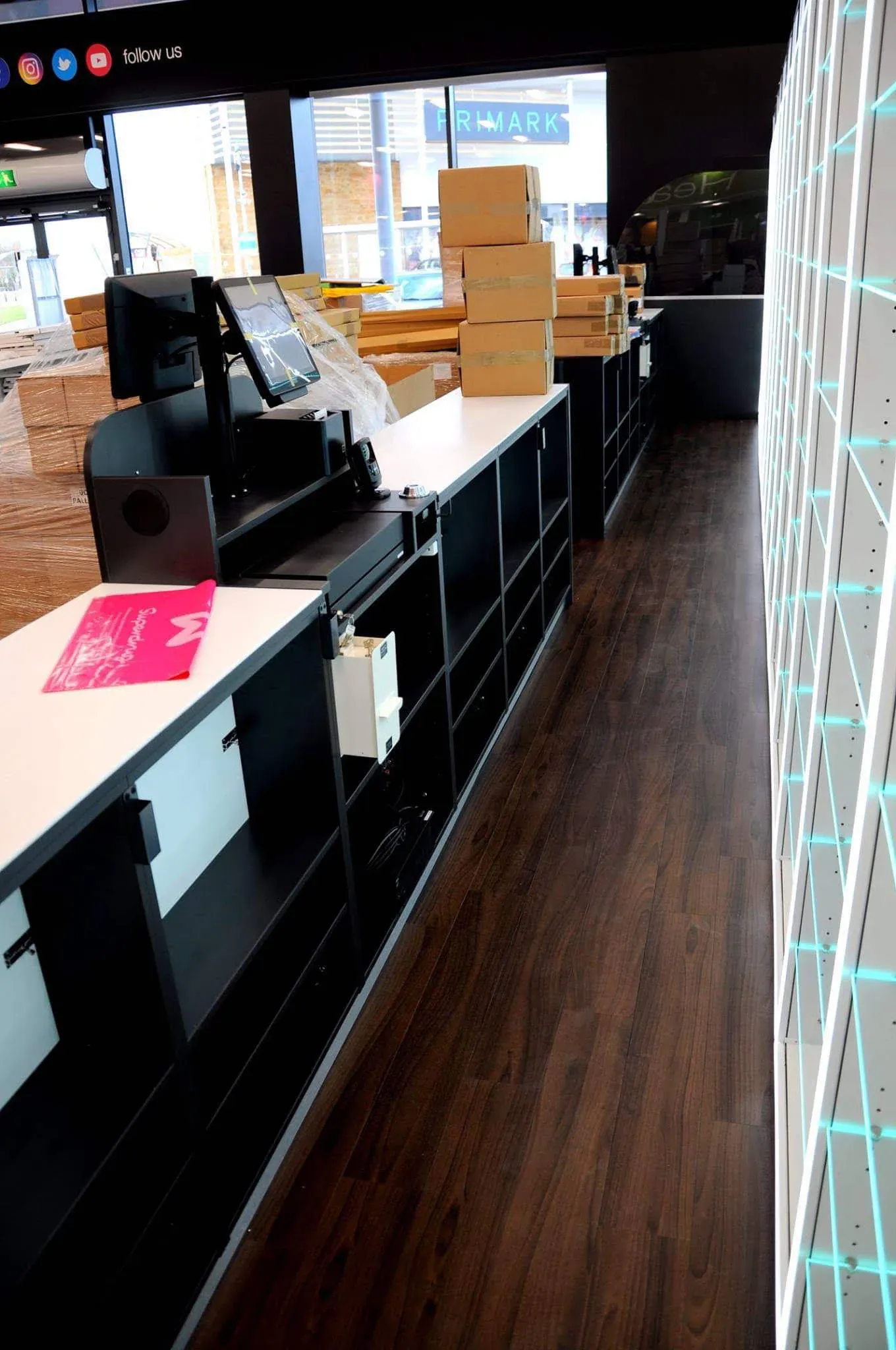 A white service counter and new shelving in a finished store