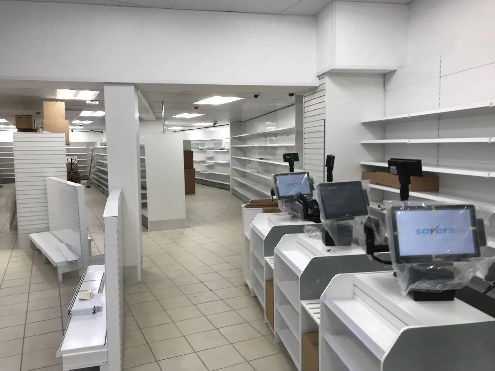 New white shelving and tills in a finished Savers store