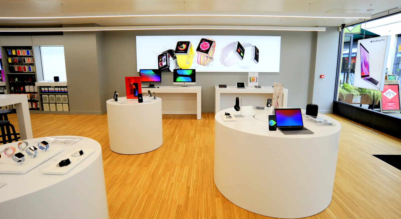 Display plinths and laptop benches by the shop windows