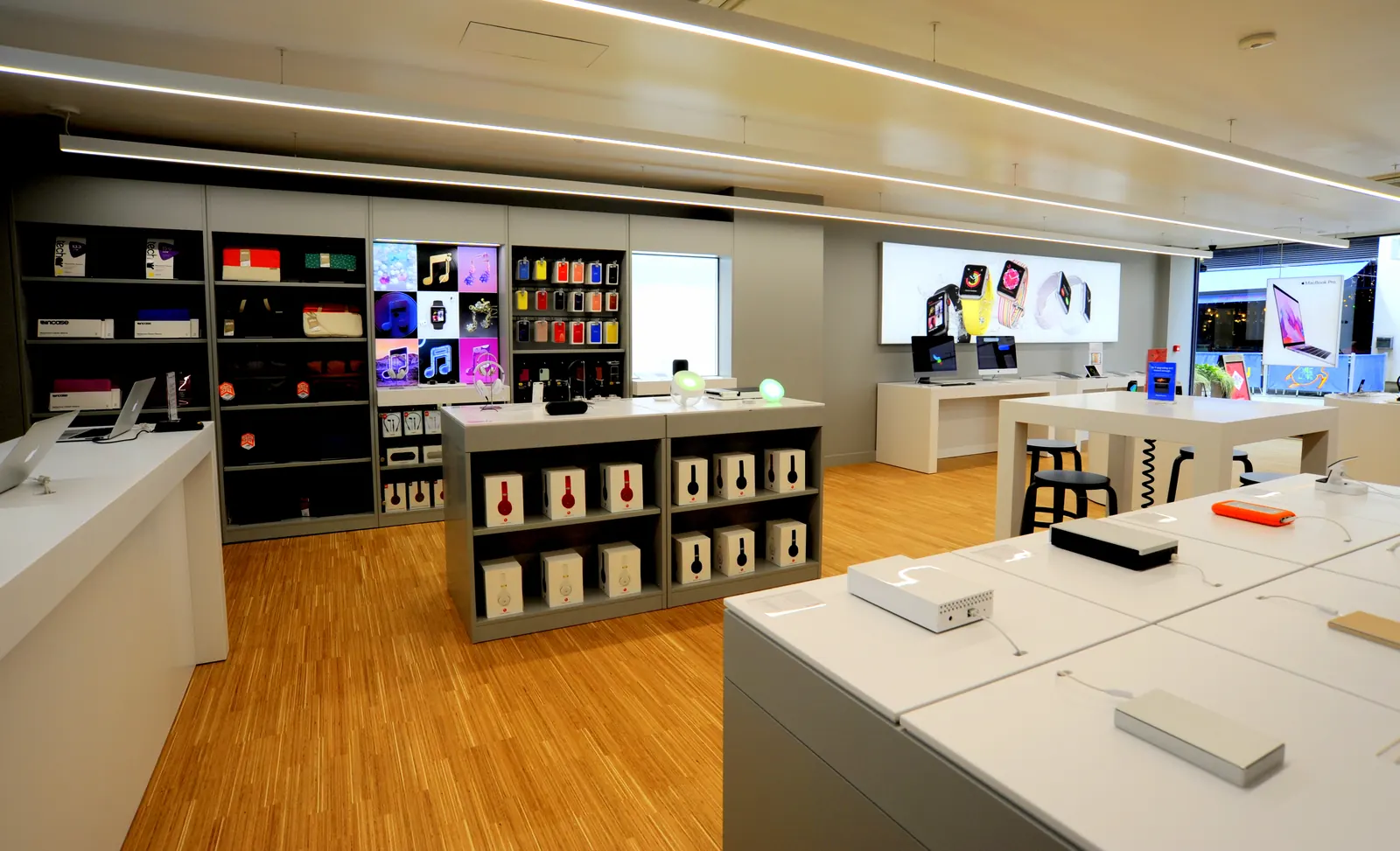 A finished store with display units, accessory shelving and laptop benches