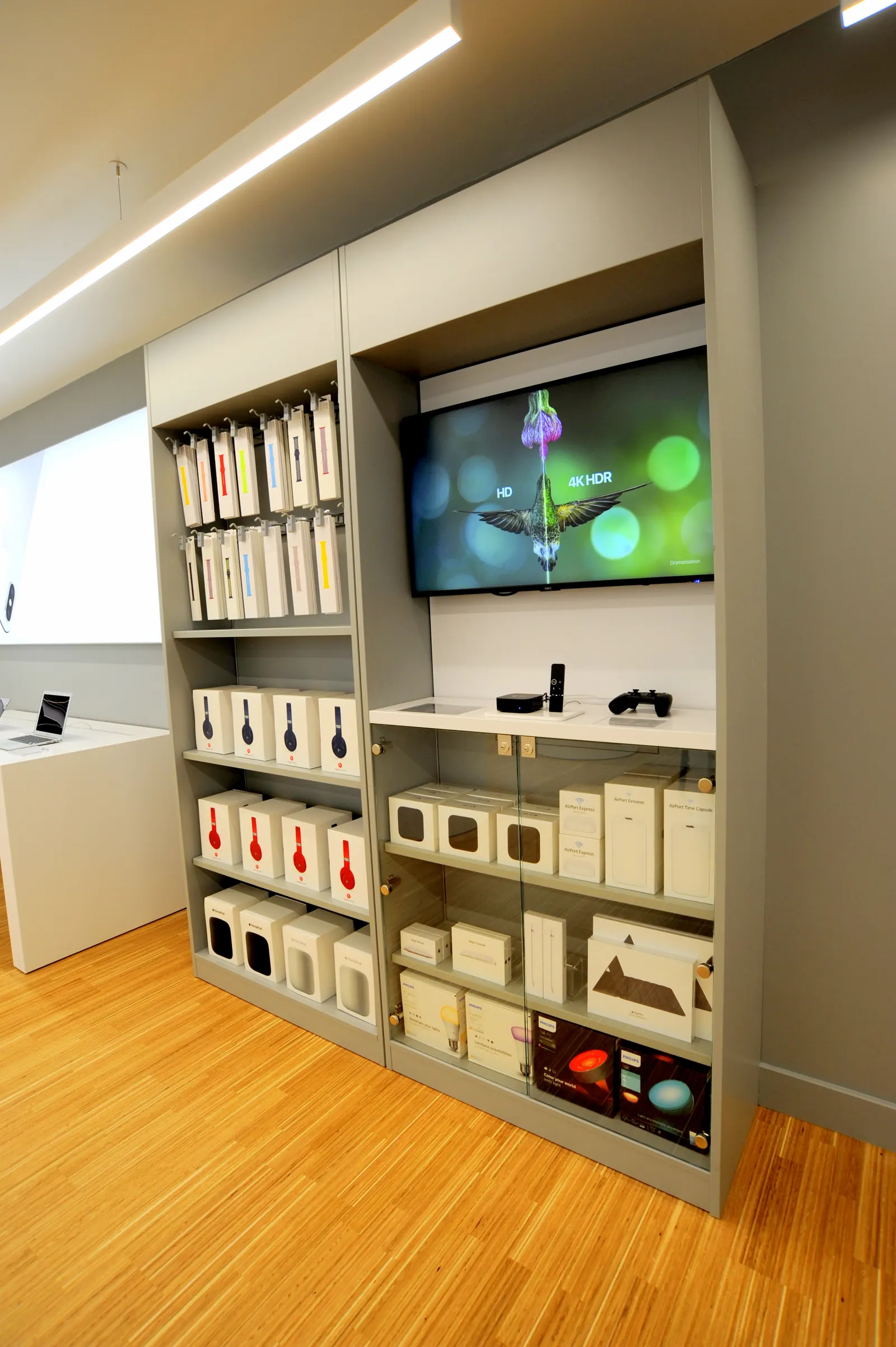 Accessory shelving and a wall-mounted screen in a finished store