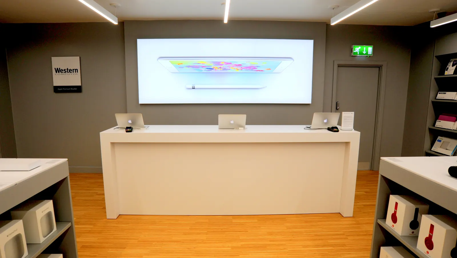 A finished white service counter in front of a full-width lightbox